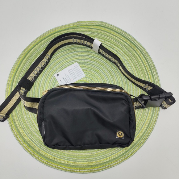 lululemon athletica Handbags - Lululemon Everywhere Crossbody Belt Bag Wordmark Black/Gold